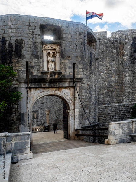 Fototapeta Closeup of Pile Gate with flag of Croatia in the background. 