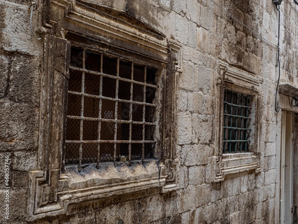Obraz Ironclad window covering set into fortified stone wall around Dubrovnik, Croatia.