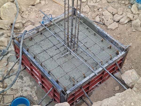 Fototapeta Concrete in a steel form poured concrete in the building construction area on the mountain