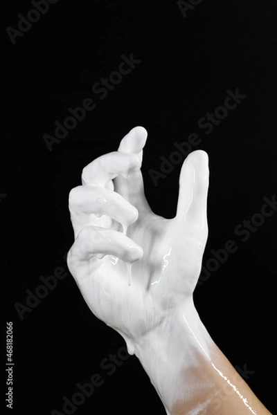 Obraz an open palm with a flowing liquid