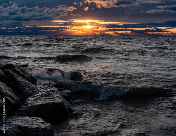 Obraz Dramatic sunset over water