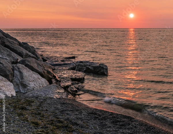 Obraz Dramatic sunset over water