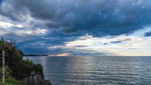 Obraz Dramatic sunset over water