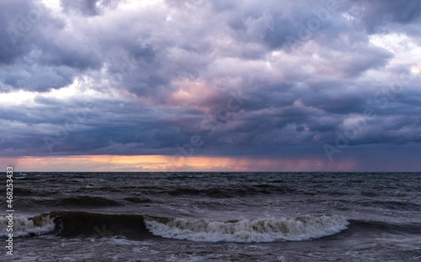 Obraz Dramatic sunset over water