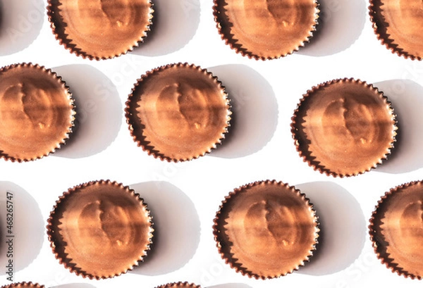 Fototapeta Peanut butter filled candy with chocolate frosting isolated on white background