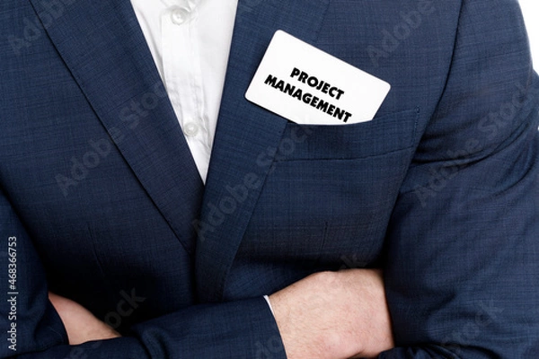 Fototapeta A businessman shows an inscription: PROJECT MANAGEMENT