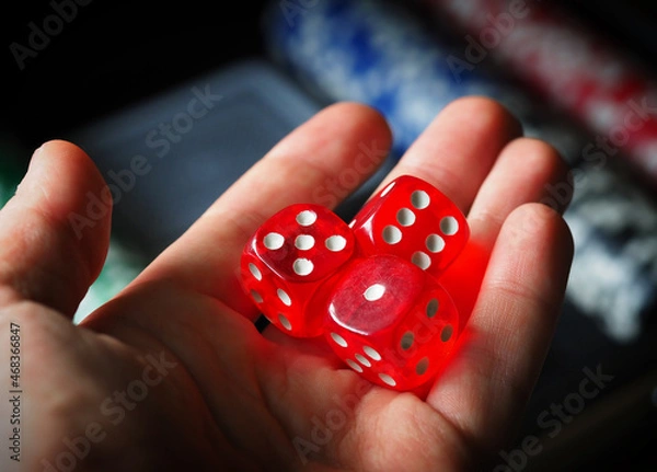 Fototapeta red playing dice, poker plastic chips, close-up, macrophotography, selective focus, blurry background, risk concept, stock exchange game, casino, gambling, gambling, excitement