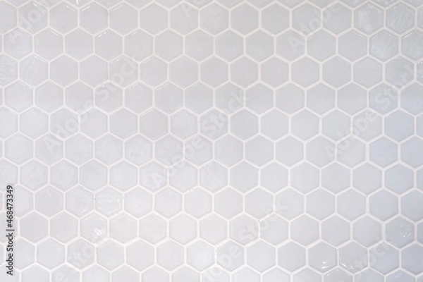 Fototapeta Tiles. A white marble wall with hexagon tiles for texture and background. White marble wall with hexagon pattern.