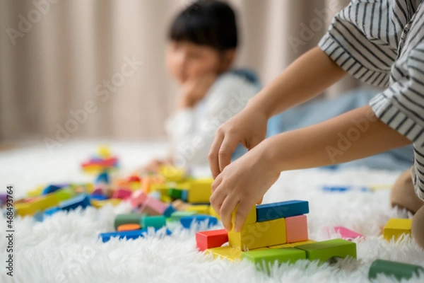 Fototapeta Little Children Playing Toy Blocks,Cute child play with color toy,Educational toys for child.