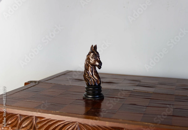 Fototapeta chess piece knight on the board, white background