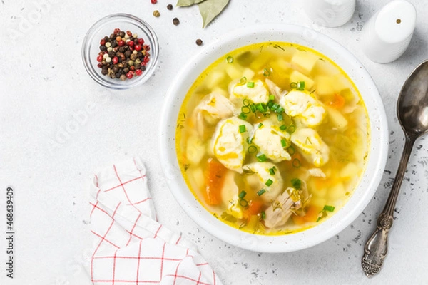 Obraz Turkey vegetable  soup with dumplings. Top view, copy space.
