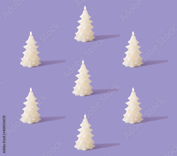 Obraz Christmas creative pattern made of white shiny candles with flame in shape of Christmas tree. Pastel purple background. Winter holidays and New Year idea.