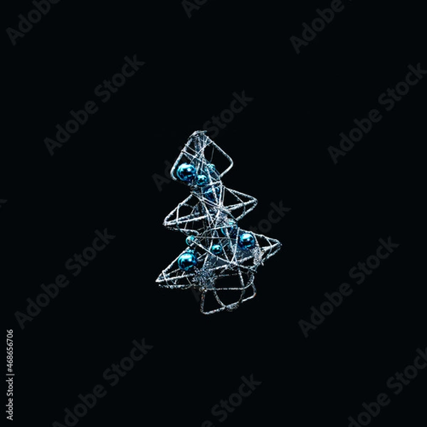 Obraz Silver Christmas tree with metallic blue baubles with black background. Cyberpunk aesthetic style.