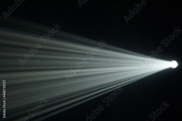 Fototapeta Light beam from spotlight or projector texture and black  background  and copy space - backdrop image