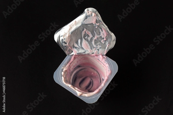 Fototapeta Plastic container with leftover yogurt