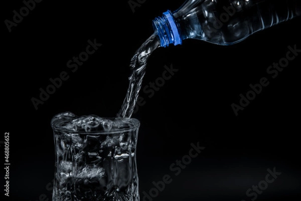 Obraz Bottle water poured into a glass