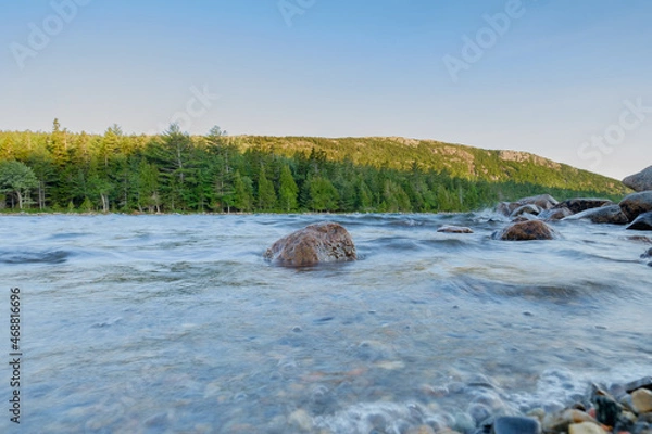 Obraz Large Pink Granite boulder sits in the rough waters of Jordan pond on a very windy morning