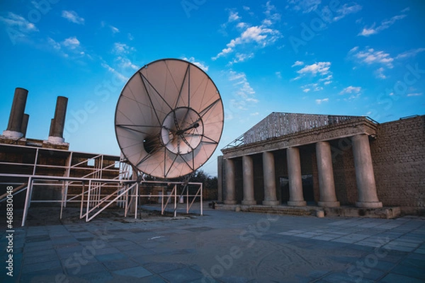 Fototapeta The right part is the main scene of an abandoned Kazantip in the village of Popovka, Crimea. A huge megaphone at sunset and a building with columns