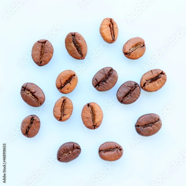 Fototapeta Coffee beans on white background. Top view.