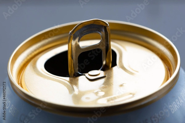 Fototapeta Aluminum tin can for drink. Tin Copper Can for beer. Jar for fizzy water. Capacity for carbonated fruit water. Soda in a container. Close-up