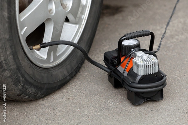 Obraz air compressor for car  wheels in working position