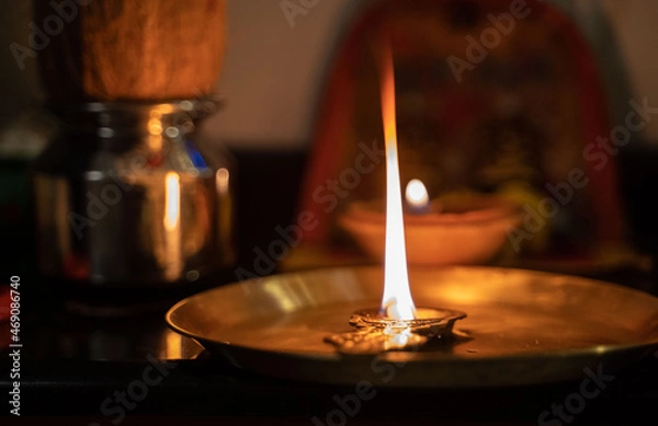 Obraz burning candle in the fireplace