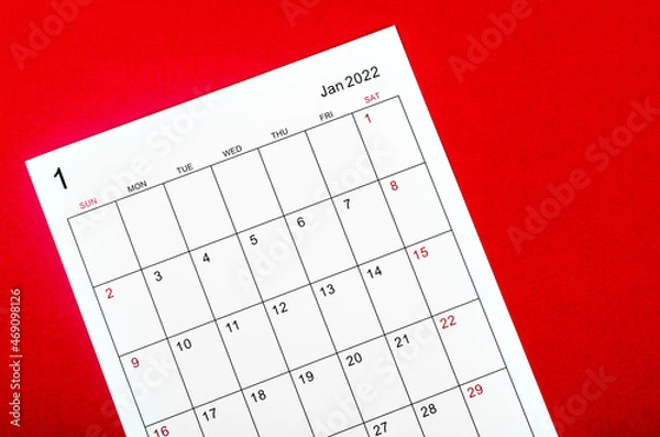 Fototapeta January 2022 calendar sheet on red background.