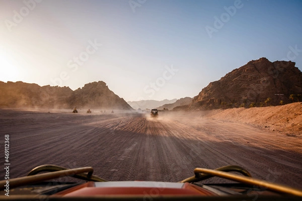 Fototapeta First-Person Front View of Safari Trip on ATV