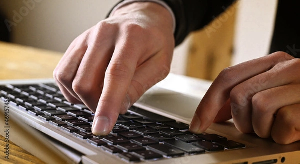 Fototapeta Business man typing on keyboard laptop in office. 