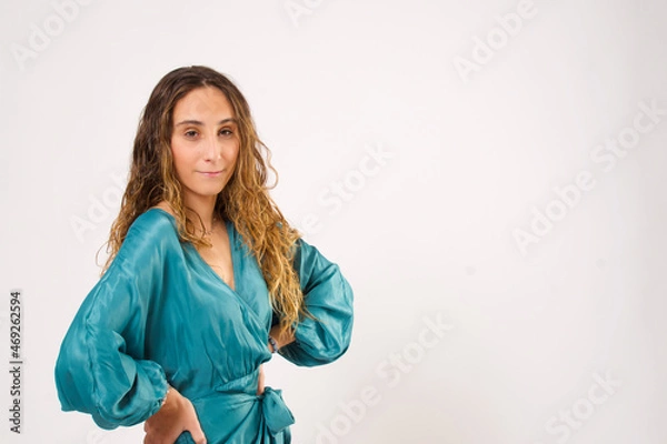 Obraz Stylish woman looking at camera while posing on an isolated background.