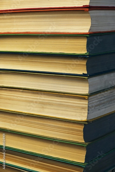 Fototapeta Stack of battered old books.Retro library and books.