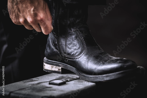 Obraz leather boots on valise