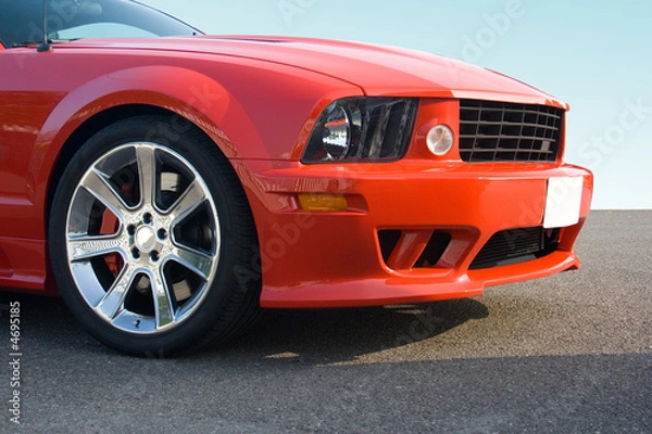 Obraz Front of red American muscle car with chrome wheels