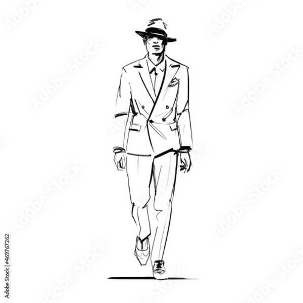 Fototapeta Strolling dapper gentleman wearing a debonair double breasted suit and a fedora hat