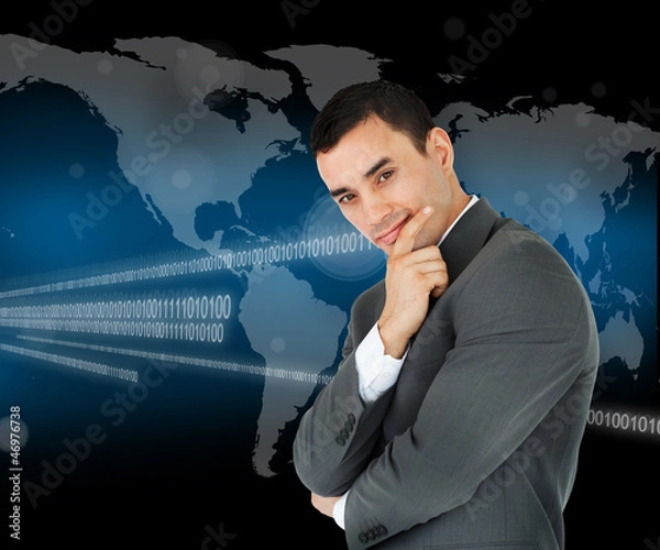 Fototapeta Businessman standing in front of world map