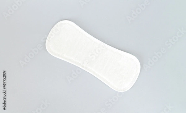 Obraz Natural daily sanitary pad or pantyliner top view on gray background