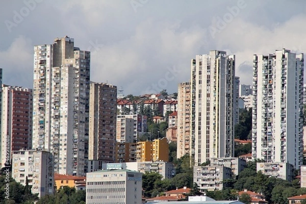 Fototapeta very high skyscrapers, blocks by the sea, the coast of the Croatian city of Rijeka, buildings of Rijeka, colorful buildings, windows with shutters