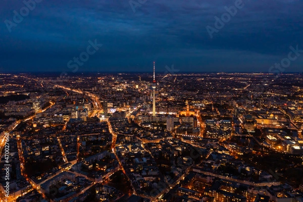 Obraz Amazing aerial panoramic night shot of city centre. Illuminated streets of large town. Fernsehturm TV tower, Berlin, Germany