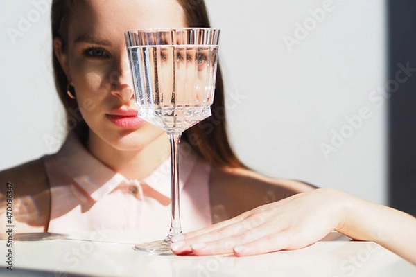 Obraz Conceptual surreal portrait Caucasian woman looking through glass of water