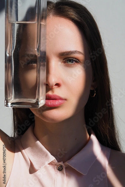 Obraz Conceptual surreal portrait Caucasian woman looking through a vase of water