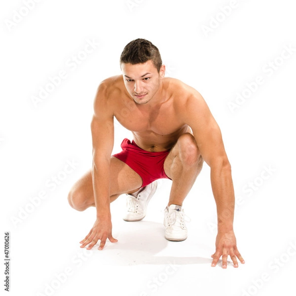 Obraz Portrait of young man ready to run