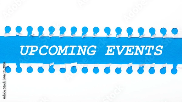 Obraz On a blue background with text UPCOMING EVENTS two white torn strips of paper.