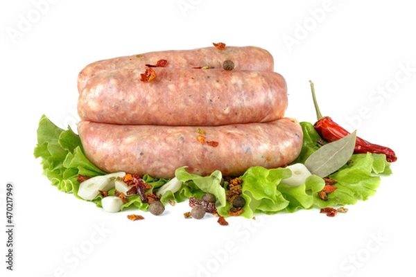 Fototapeta Raw pork sausages.Grilled sausages in close-up, isolated on a white background.Selective focus.