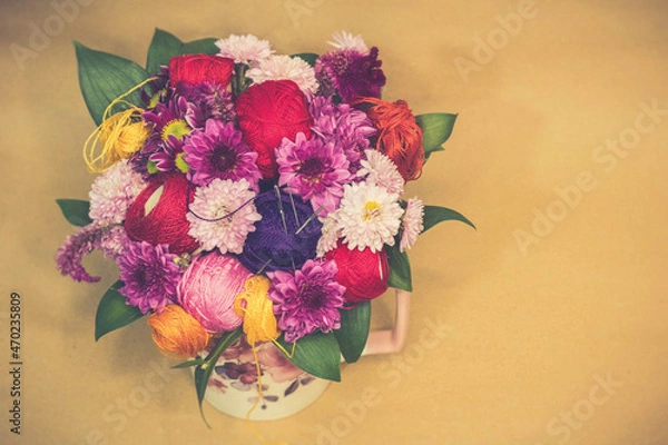 Fototapeta Decoration of thread for embroidery needles and colorful flowers