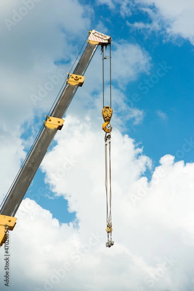 Fototapeta Crane boom with construction hook on sky background