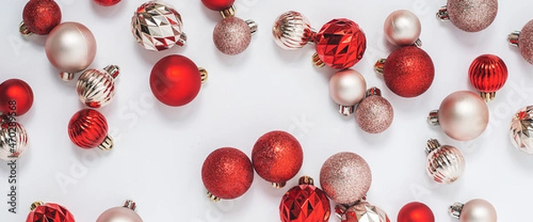 Fototapeta Beautiful decorative balls on a white background. Top view, flat lay. Banner.