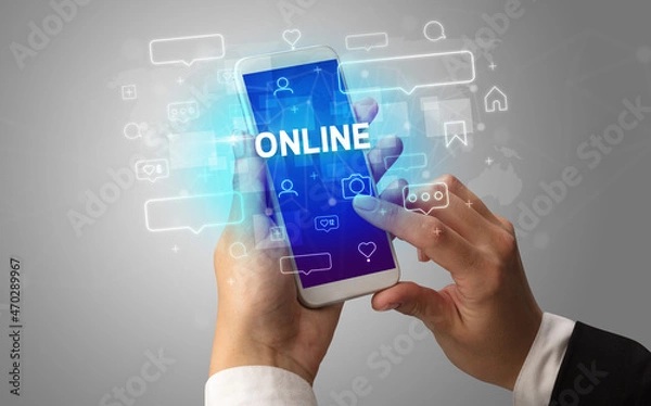 Fototapeta Hand using smartphone with social media concept