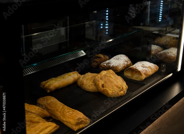 Fototapeta Delicious treats and snacks for breakfast in a coffee shop display