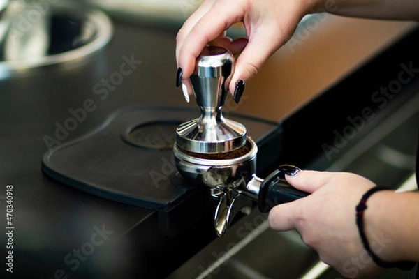 Fototapeta Espresso coffee beans and coffee grinder in a small coffee shop