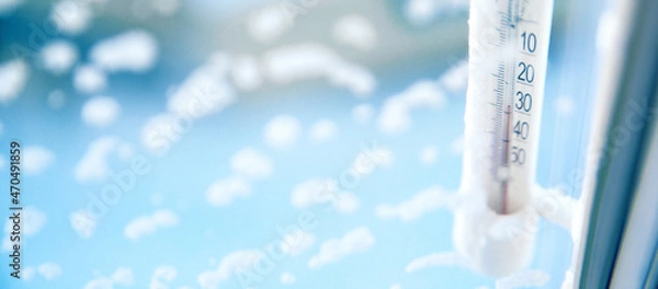 Fototapeta Classic mercury thermometer for measuring ambient temperature, hanging outside the window, with readings minus 30 degrees Celsius.